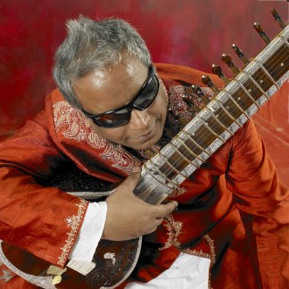 BALUJI IN RED WITH SITAR
